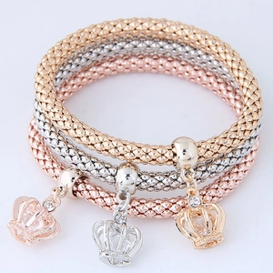 Three-tone crown pendant beaded stretch bracelets in rose gold, silver, and gold finish