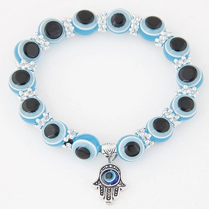 Vintage Hamsa Hand and Blue Evil Eye beaded bracelet with silver textured spacers