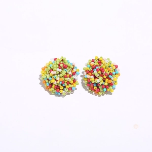 Close-up of bohemian colorful seed bead cluster stud earrings with vibrant floral style