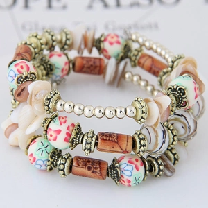 Bohemian multilayer beaded bracelet featuring colorful ceramic beads and natural shells