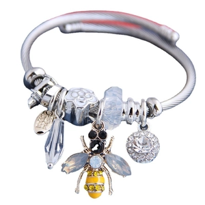 Bohemian style bangle bracelet with crystal flower and honey bee charm in silver finish