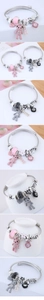 Close-up of heart charm and pavé bear pendant on adjustable beaded charm bracelet
