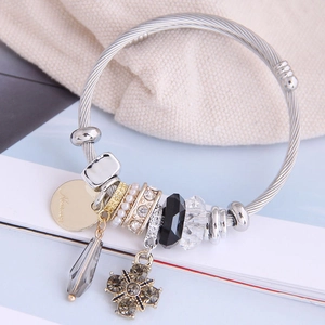 Silver beaded bracelet with four-leaf clover charm, crystal beads and faux pearl pendants