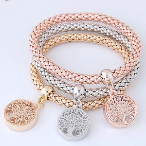 Three-piece popcorn chain bracelet set in rose gold, silver, and gold with tree of life charms