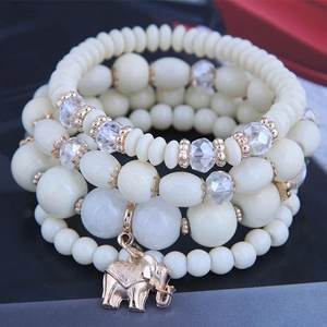 Fashionable four-piece beaded bracelet set with golden elephant pendant and crystals