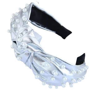 Silver knot wide headband with white faux pearls on minimalist white background