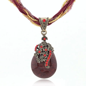 Bohemian multi-layer long necklace with deep red pendant and vintage bronze accents