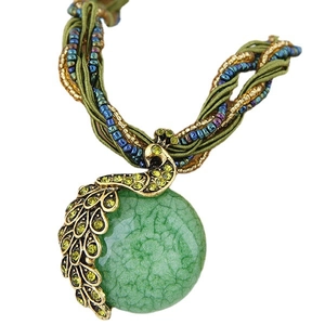 Bohemian peacock pendant necklace with green gemstone and colorful handmade beads
