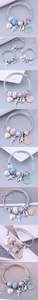 Gros plan détaillé du bracelet à breloques avec coquillages, perles et anges pendentifs