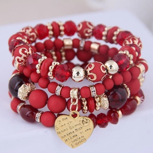 Multilayer red beaded bracelet set with gold heart pendant engraved with Te Amo