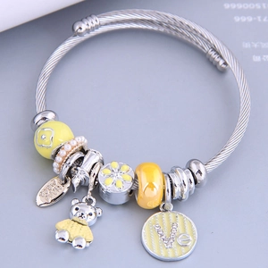 Charming silver steel wire bangle with yellow enamel bear and pearl charms for women