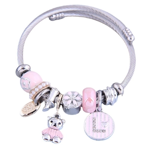 Adjustable wire bracelet with pink bear charm, crystal beads and pearl accents
