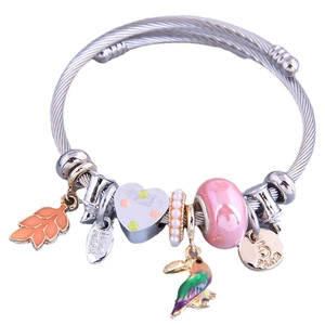 Adjustable wire rope bracelet with colorful enamel charms, toucan pendant and glass beads