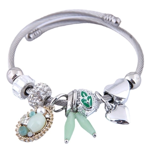 Silver twisted wire bracelet with green gemstone pendant and multifaceted crystal beads