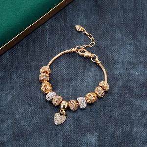 Gold snake chain charm bracelet with sparkling heart pendant and crystal beads