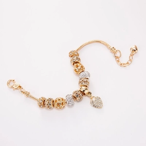 Gold snake chain bracelet with heart charms and sparkling crystal pave beads