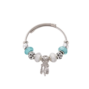 Silver bead bangle with dreamcatcher feather pendant and blue glitter beads