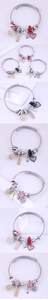 Detailed view of handmade beaded charm bracelets with heart pendants and pearls