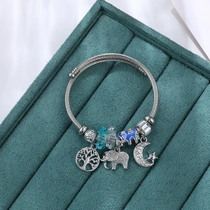 Silver steel wire tree of life bracelet with blue elephant and star moon charms