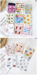 Flat lay detail of cooling ice silk sun sleeves with cute cartoon patterns and floral prints