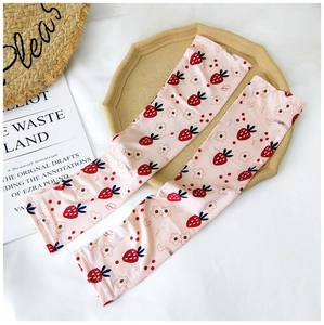 Detail of pink ice silk sun sleeves with strawberry prints and lucky text design