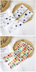 Detail of breathable ice silk sun protection sleeves with cute cartoon bear and floral patterns