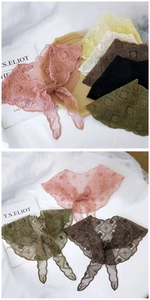 Detailed view of lightweight mesh lace scarves with elegant floral embroidery and wavy edges