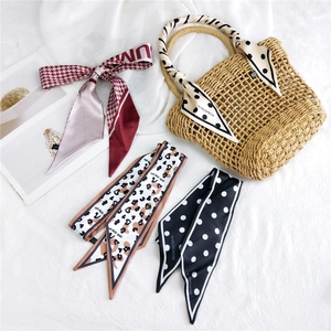 Chic polka dot and houndstooth narrow silk scarves used as bag accessories and neck ribbons