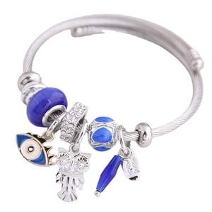 Adjustable stainless steel charm bracelet with blue evil eye and owl pendant charms