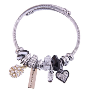 Adjustable silver steel cable bracelet with pearl, crystal heart, and handmade tags