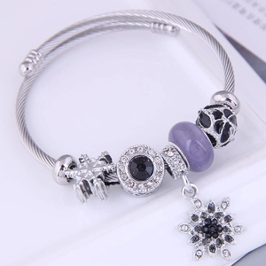 Bohemian beaded charm bracelet with lilac cat eye stone and snowflake tassel pendant