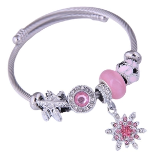 Bohemian beaded charm bracelet with pink cat eye stones and snowflake tassel pendant