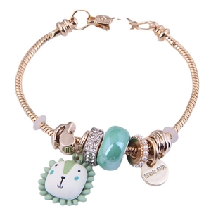 Bracelet chaîne serpent dorée avec pendentif lion vert, perle en verre et médaille Morava