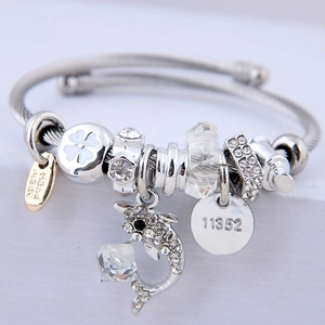 Silver steel wire bracelet with crystal beads and sparkling diamond dolphin pendant