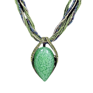 Bohemian necklace with green teardrop pendant and multi-strand green beaded rope chain