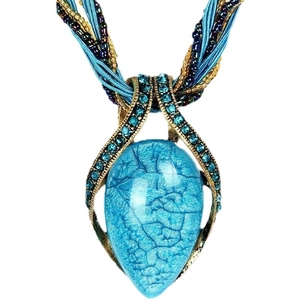 Bohemian ethnic necklace with blue teardrop stone pendant and beaded cord