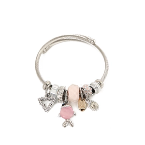 Silver woven wire bracelet featuring pink fish charm, crystal heart, and floral beads