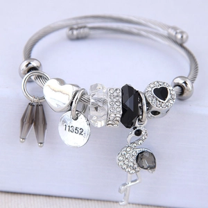 Bracciale regolabile in acciaio inossidabile con ciondolo fenicottero e perle di cristallo