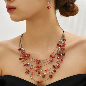 Bohemian multilayer necklace and earrings set with red crystals and silver beads