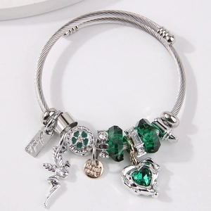 Silver twisted charm bracelet with green heart crystals and fairy wing pendant charms