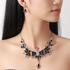 Peacock crystal jewelry set with necklace and earrings featuring black gems on silver alloy