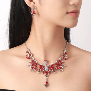 Middle Eastern peacock jewelry set with sparkling red teardrop zircons on a model