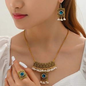 Bohemian pearl jewelry set featuring blue gemstone necklace, drop earrings and ring