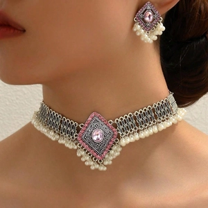 Vintage silver ethnic jewelry set with pink gemstones and white pearl tassels