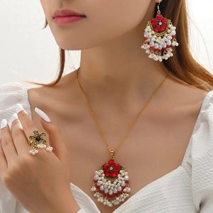 Bohemian ethnic jewelry set with red crystal and white pearl in gold setting
