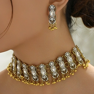 Vintage gold jewelry set with crystal necklace and earrings in ethnic tassel style