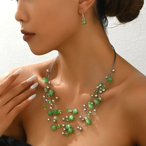Bohemian multi-layer necklace and earring set with green cat eye stones and crystals