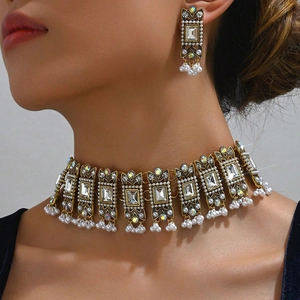 Indian style vintage gold jewelry set with square rhinestones and pearls on model