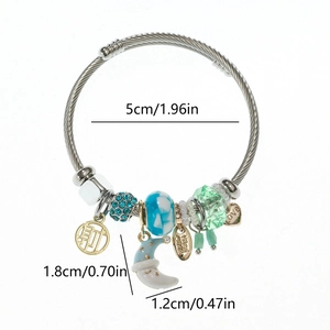 Silver steel wire bangle with moon pendant, blue rhinestones, and heart charms