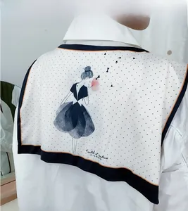 Detail of nautical collar shawl with hand-drawn girl illustration and black polka dots
